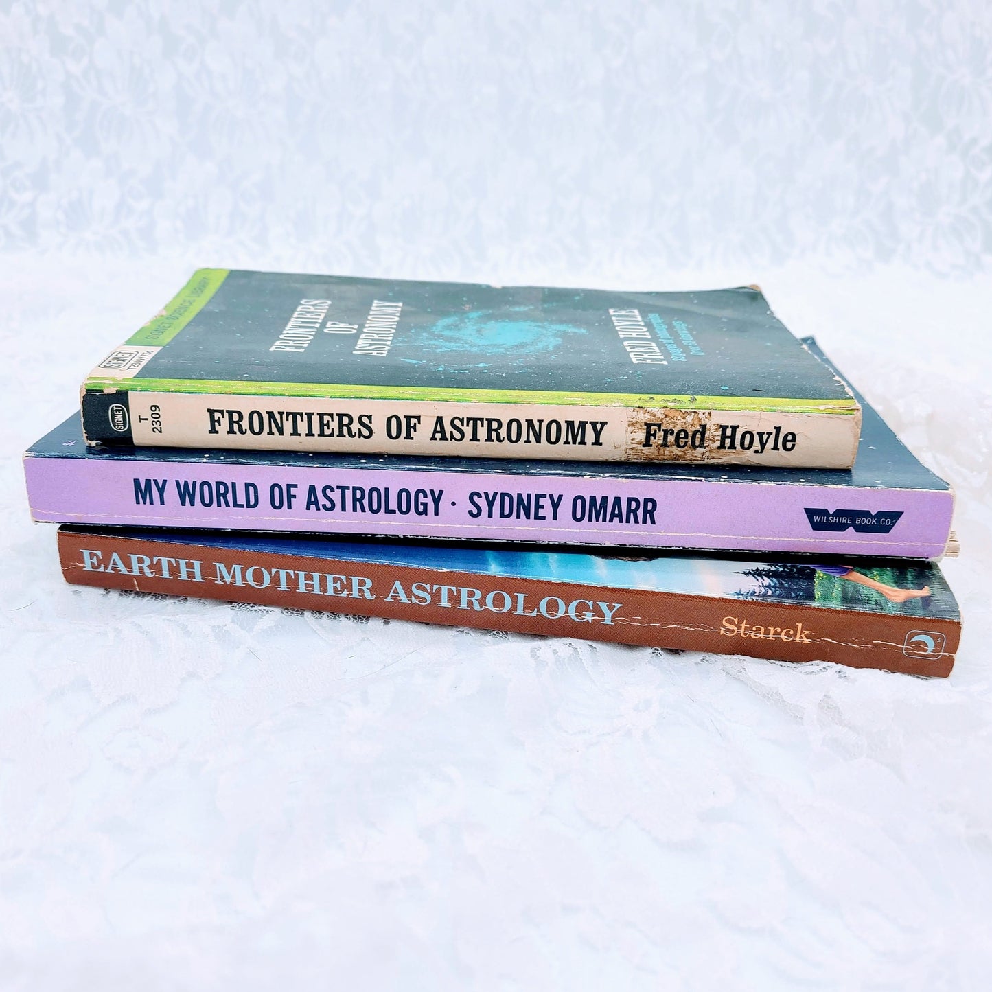 #1) Frontiers of Astronomy by Fred Hoyle  #2) My World of Astrology by SYDNEY OMARR (CLASSIC and a MUST HAVE)  #3) Earth Mother AStrology by Stark